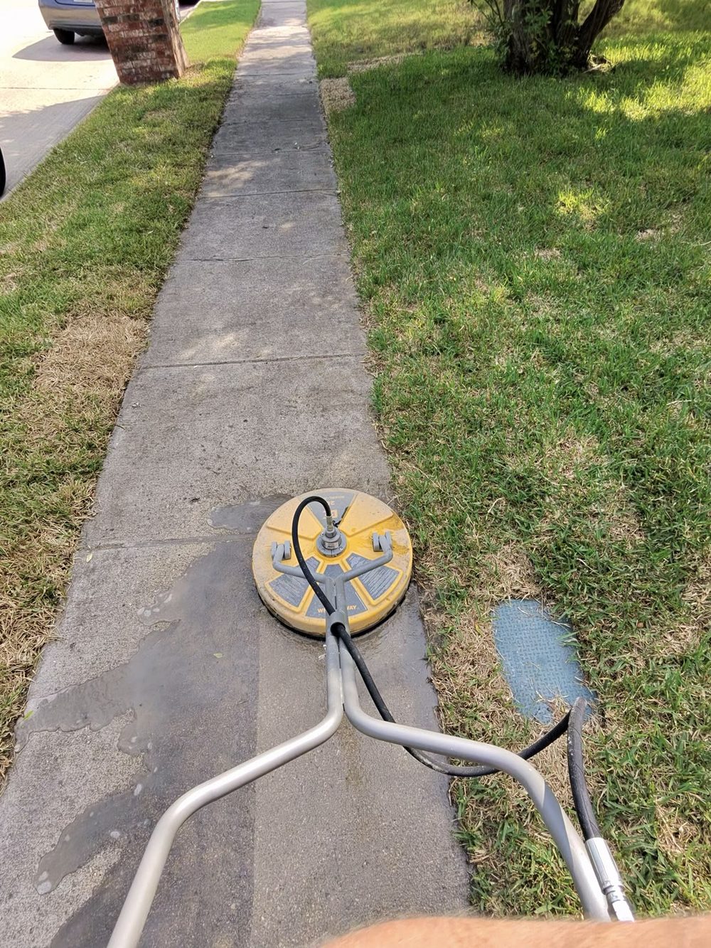 Public sidewalk pressure washing in Celina, Texas on a sunny afternoon — Green Clean Machine