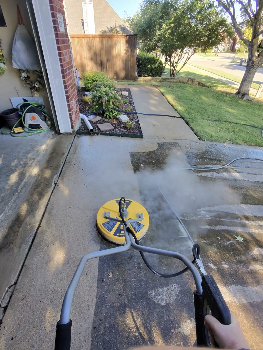 Walkway pressure washing with visible hot water steam in Allen, Texas — Green Clean Machine